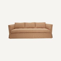 a brown and white striped couch with pillows on it's back end, against a gray background