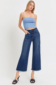 High Rise Raw Hem Cropped Wide Leg Jeans are the perfect addition to your wardrobe. With their high rise fit, raw hem detail, and wide leg silhouette, these jeans offer a stylish and modern look. The cropped length adds a trendy touch, making these jeans versatile for various occasions. Pair them with a tucked-in blous Retro Pants, Cropped Wide Leg Jeans, Effortless Outfit, Cardigan Crop Top, Cardigan Crop, Comfortable Jeans, Raw Hem Jeans, Leg Design, Capri Jeans