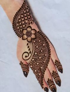 a henna design on the palm of someone's hand