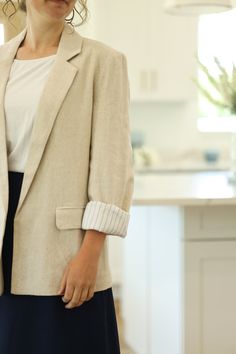 Our Chloe Blazer is made of a beautiful linen fabric in a natural color. This blazer is fully lined and has front pockets. Made with an open design, this blazer is perfect for a business casual or dressy style! - Notched lapels - Long sleeve - Front pockets - Open blazer design - Lined - Material: Self: 45% Rayon | 55% Linen Lining: 100% Rayon - Model is wearing a small. Color Disclaimer: Actual colors may vary due to computer monitors. *Measurements are taken flat, and then doubled.* Size Bust Blazer Design, Dressy Style, Open Blazer, Skirts For Kids, Boys Denim, Dressy Fashion, Blazer Designs, Sweater Dress Midi, Open Design