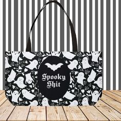 This spooky season, make sure you're ready to transport all your ghostly needs with this Ghoulishly Glamorous Ghost Spooky Shit Weekender Tote Bag. With its fun black lining and handles, this tote is perfect for packing up all your spooky shit for weekends away! (Don't worry, no ghosts included). DETAILS Measures – 24" x 13" (60.9 cm x 33 cm) Features black interior lining and black handles Assembled and printed in the USA Please allow a size tolerance of +-0.75 MADE TO ORDER Each bag is custom Novelty Black Halloween Bags, Novelty Black Bags For Halloween, Black Rectangular Bag For Halloween, Rectangular Black Bag For Halloween, Spooky Black Halloween Bags, Spooky Black Bags For Halloween, Black Large Capacity Bags For Halloween, Large Capacity Black Bag For Halloween, Black Handles