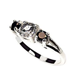 Unique Salt and Pepper Diamond Ring with Black Diamond Accents in Sterling Silver Discover the allure of individuality with this one-of-a-kind Salt and Pepper Diamond ring, elegantly crafted in sterling silver and accented by striking black diamonds. This distinctive piece features a 0.86ct Salt and Pepper diamond, a gemstone known for its natural inclusions that create an intriguing and unique look. Flanked by 0.54tcw of heat-treated black diamonds, this ring offers an edgy yet sophisticated appeal—perfect for those seeking a truly unique jewelry piece.  Key Features: Salt and Pepper Diamond: A 0.86ct genuine Salt and Pepper diamond, celebrated for its natural inclusions that give it a mysterious, speckled appearance. These inclusions are what make Salt and Pepper diamonds so special, eac Salt And Pepper Diamond Ring, Pepper Diamond Ring, Black Diamond Ring, Black Diamonds, Salt And Pepper Diamond, Elegant Ring, Bridal Rings, Black Diamond, Salt And Pepper