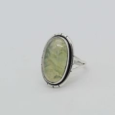 Genuine Prehnite Silver Ring, Gemstone Ring, Green Statement Ring, 925 Silver Rings, Engagement Gift, Prehnite Ring, Women Rings, Boho Gifts * Gemstone : Green Prehnite * Weight : 6.5 Gram Approx * Stone Shape : Oval * Stone Size : 12x20 mm * All our work is custom made by hand with Love and Care in our workshop ♡ Prehnite Pendants https://www.etsy.com/shop/silverjewelryexim925?ref=seller-platform-mcnav&search_query=Prehnite+pendants Prehnite Earrings https://www.etsy.com/shop/silverjewelryexim925?ref=seller-platform-mcnav&search_query=Prehnite+earrings Prehnite Rings https://www.etsy.com/shop/silverjewelryexim925?ref=seller-platform-mcnav&search_query=Prehnite+rings 》W H Y T O W E A R S I L V E R《 As a metal, silver has significant health benefits that have been used across cultures for c Green Oval Prehnite Rings, Green Oval Moonstone Ring In Sterling Silver, Silver Rings Engagement, Prehnite Ring, Rings Boho, Mom Daughter Gifts, Big Stone Ring, Wedding Engagement Gifts, Rose Quartz Ring