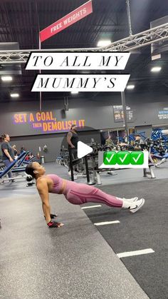 a woman doing push ups in a gym