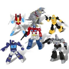 five different types of toy action figures on a white background