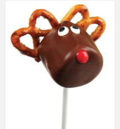 a chocolate reindeer lollipop on a stick with pretzels sticking out of it