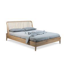 a wooden bed frame with two pillows on the top and bottom, in front of a white background