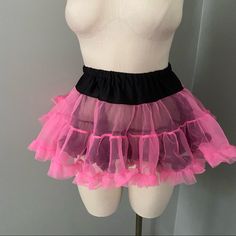 a mannequin with pink and black tulle skirt on it's torso