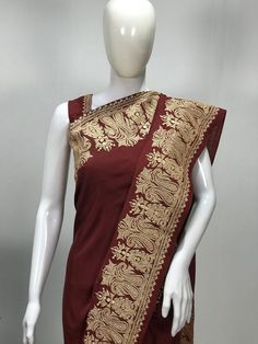 A Marvellous Embroidered Kashmiri Saree which you can wear at any party or a wedding.- - - - - - - - - - - - - - - - - - - - - - - - - - - - - - - - - - - - - - - - Product Details- Condition: Brand New (made to order)- Style: Women Saree Dress- Embroidery: Kashmiri Zari Embroidery- Base Colour: Maroon- Embroidery Colour: Gold- Care Instructions: Dry Clean OnlyF A B R I CSaree: Pure SilkBlouse: Pure SilkF I N I S H- UnstitchedYou can get it stitched locally.- StitchedWant your blouse ready to we Brocade Pre-draped Saree With Resham Embroidery, Traditional Embroidered Raw Silk Pre-draped Saree, Embroidered Silk Pre-draped Saree For Puja, Traditional Embroidered Pre-draped Saree For Festive Occasions, Embroidered Chanderi Pre-draped Saree For Puja, Pre-draped Saree With Embroidered Border For Eid Puja, Brocade Saree With Resham Embroidery, Pre-draped Saree With Embroidered Border For Diwali Ceremonies, Anarkali Style Pre-draped Embroidered Saree