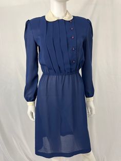 36" Bust 30" Waist 34" Hips 40" Shoulder to hem This item is used. Please wash before wearing, we do not launder. Staining/discoloring on collar and white sleeves. PLEASE see photos No other flaws found, great vintage condition. Shoulder pads attached, can be removed. Classic Blue Dress For Vintage Fashion, Blue Vintage Dress With Buttons For Vintage Fashion, Blue Vintage Dress With Buttons, Blue Vintage Dress With Buttons For Spring, Spring Blue Vintage Dress With Buttons, Blue Knee-length Vintage Dress For Vintage Fashion, Retro Blue Button-up Dress, Formal Long Sleeve Blue Vintage Dress, Formal Blue Long Sleeve Vintage Dress