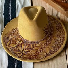 Burned Wide Brim hat using Pyrography techniques. Freehand Art making this a one of a kind. Hat is adjustable. Hat is sprayed for weather protection. Hat comes with Signature PIPER Tote/Dust Bag and macrame wall hanger. Custom Adjustable Fedora For Outdoor, Artisan Adjustable Fedora For Outdoor, Handmade Adjustable Fedora For Outdoor, Handmade Country Hat For Outdoor, Handmade Country Style Outdoor Hat, Artisan Brimmed Hats For Outdoor, Artisan Brimmed Outdoor Hats, Artisan Hand Painted Adjustable Hat Bands, Handmade Adjustable Artistic Hat Bands