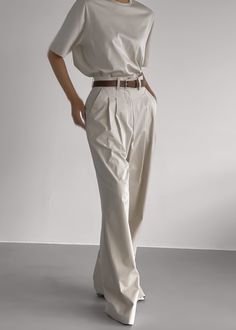 Color: Taupe Lightweight cotton blend fabric Wide leg High rise Pleat front detail Pressed crease Side seam pockets Single illusion welt back pocket Belt loops Hook and bar closure Zip fly Unlined 97% Cotton 3% Polyurethane Dry Clean By The Frankie Shop. Imported Formal Cotton Wide Leg Pants With Relaxed Fit, Neutral Cotton Pants With Belt Loops, Neutral Cotton Pants For Business Casual, Business Casual Cotton Wide Leg Pants With Pockets, Cotton Wide Leg Pants With Pockets For Business Casual, Chic Cotton Pants For Workwear, Formal Cotton Wide Leg Pants With Welt Pockets, Business Casual Neutral Cotton Pants, Chic Cotton Workwear Pants