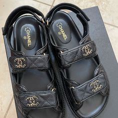 New Full Set With Receipt Chanel Caviar Dad Sandals In Black Original Packaging : 2 Dust Bags, And Box Made In Italy Style Code : G35927 X56140 94305 These Stylish Sandals Are Crafted Of Black Grained Calfskin Leather. These Sandals Feature Velcro Ankle Straps And A Gold Chain Leather Threaded Chanel Logo On The Uppers. These Are Excellent Shoes For A Timeless Look Only From Chanel! Chanel Thong Sandals, Dad Sandals, Chanel Espadrilles, Chanel Black And White, Raffia Sandals, Italy Style, Chanel Sandals, Chanel Logo, Pink Chanel