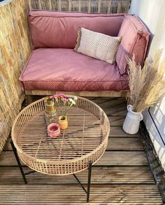 a couch and table on a wooden deck