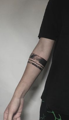 a man with a tattoo on his arm