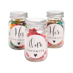 three jars filled with different types of candy