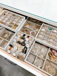 the drawers are filled with jewelry and bracelets