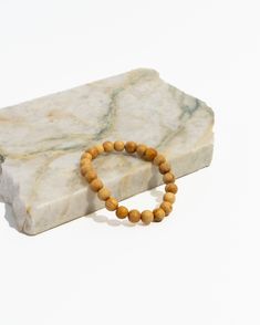 Discover the perfect blend of beauty and protection with our exclusive gift set & bracelet stack, featuring three distinct malas: Blue Tiger's Eye Mala, Blue Gold Tiger's Eye and Palo Santo Mala, and Palo Santo Diffuser Mala. This elegant set is designed to ward off negative and toxic energy while adding confidence, protection, & a touch of sophistication to your style. Features: Blue Tiger's Eye Mala: This rare and coveted stone is known for its protective properties, shielding you from negativ Holistic Wooden Beads Bracelets For Meditation, Minimalist Hand-strung Beaded Bracelets For Meditation, Spiritual Wooden Beads Stretch Bracelet For Meditation, Spiritual Stretch Bracelet With Wooden Beads For Meditation, Natural Wood Round Beads Bracelet Gift, Gift Natural Wood Round Bead Bracelets, Gift Natural Wood Round Beads Bracelet, Spiritual Wooden Beads Stretch Bracelet For Everyday, Spiritual Stretch Bracelet With Wooden Beads For Everyday