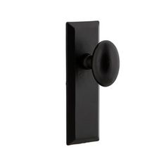 a black door handle with an oval knob on the front and back of it, against a white background