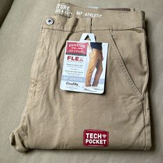 Nwt Levi Strauss S67 Athletic Pants W/Tech Pocket Khaki Color Modern Fit With Relaxed Seat And Thigh With A Slim Leg Zippered Tech Pocket On Right Hip Stored In A Tote In A Smoke And Pet Free Home Fitted Khaki Work Pants With Pockets, Fitted Khaki Work Pants, Stretch Tapered Leg Work Pants With Pockets, Stretch Work Pants With Pockets And Tapered Leg, Chino Pants Men, Adidas Track Suit, Levi Strauss Jeans, Compression Pants, Adidas Track