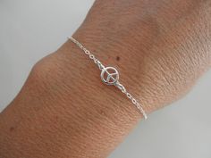 Tiny peace sign bracelet DE T A I L S ✦ Available in silver gold: https://www.etsy.com/listing/171053147/tiny-peace-sign-bracelet-with-goldfilled rose gold: https://www.etsy.com/listing/168348296/tiny-rose-gold-peace-sign-bracelet ✦ peace charm: 7mm L E N G T H ✦ All items are made to order, so please take a moment to make sure you are ordering the correct size. ✦ choose the length you need from the drop down menu M A T E R I A L ✦ all components are 925 solid sterling silver. N O T E S 📌 19bis Adjustable Sterling Silver Peace Sign Jewelry, Peace Sign Bracelet, Unique Handcrafted Jewelry, Miami Fl, Peace Sign, Charm Bracelets, Delicate Bracelet, Silver Gold, Jewelry Bracelets