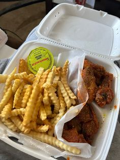 a plastic container filled with fries and meat