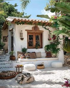 an outdoor seating area with potted plants on the side and stone steps leading up to it