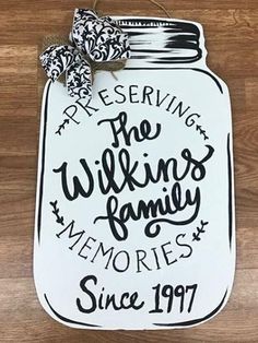 a white mason jar with the words preservers, the wikings family memories since 1917