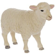 a toy sheep standing on top of a white floor