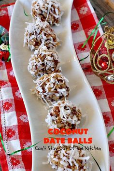 coconut date balls are on a white plate