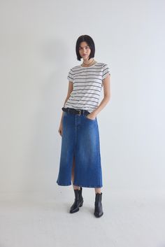 The 90's Denim Midi Skirt is a nostalgic revival of the iconic denim trends from the past, infused with a modern twist for a fresh and stylish edge. This skirt is crafted for those who appreciate the timeless charm of the '90s, making it a must-have piece for the fashion-forward individual Retro High Rise Denim Skirt For Spring, Retro Dark Wash Denim Skirt For Summer, 90s Denim Blue Denim Skirt For Spring, 90s Style Denim Blue Skirt For Spring, 90s Denim Blue Skirt For Spring, 90s High Rise Denim Skirt For Spring, 90s Style Cotton Denim Skirt For Spring, 90s Medium Wash Denim Skirt For Summer, Classic Straight Leg Denim Skirt For Spring