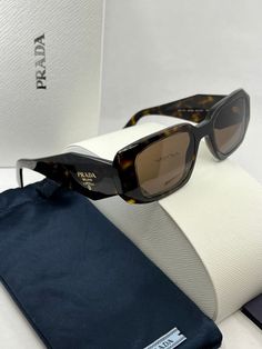 Brand new Prada PR17WS Sunglasses in Brown.Featuring a brown havana acetate frame with dark brown lenses.Gold metal Prada logos on temples.Size 49-20-145.100% authentic and unworn.Made in Italy.Box, case, cloth and paperwork included. Sold out everywhere. Designer Brown Sunglasses With Uva Protection, Designer Brown Sunglasses With Mirrored Lenses, Designer Brown Sunglasses With Uv Protection, Designer Brown Tinted Sunglasses, Designer Brown Sunglasses With Polarized Lenses, Luxury Brown Sunglasses With Uva Protection, Prada Pr17ws, Prada Pr 17ws, Prada Sunglasses