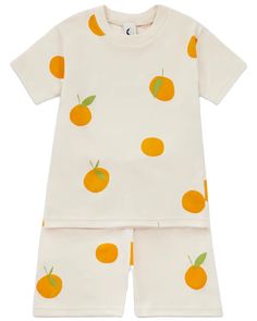 Our best selling clementine print in a short and tee set. Boxy and breezy, pyjamas don't get comfier than this. 100% organic cotton, a very soft interlock fabric for maximum night-time comfort.  Knitted ethically and printed in the U.K. using water based inks. DetailsFabric: 100% Organic CottonCare: Wash at 30 degrees, but please do not tumble dry.Weight: 8 oz (226.8 g)Made in United Kingdom Orange Cotton Sleepwear For Loungewear, Orange Cotton Pajama Party Set, Orange Cotton Top For Loungewear, Playful Orange Sleepwear For Loungewear, Playful Orange Loungewear Sets, Cute Orange Sleepwear For Loungewear, Orange Sleepwear For Spring Sleepover, Casual Orange Bedtime Set, Playful Organic Cotton Sleepwear For Loungewear