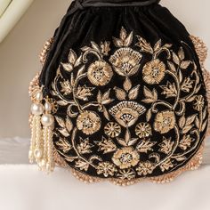 Black Velvet Potli Bag, Zardozi Katdana Sequin Embroidery Evening Bag for Wedding, Handmade Drawstring Purse, Bridesmaid Gifting Small Purse Size  : 10 x 8 Inches Pacakge Content : 1 Pcs Designed with the heart, this beautiful Potli or batawa bag are eye catchy and made of premium material. Key Features: Embroidery art work This potli is good match with both Indian and western outfits and are superb for wedding and festive parties This would be best complement to your designer saree, lenhga or any other kind of dress This is the combination of traditional and modern embroidery work This is enough to keep your accessories and all needed essentials and it can be a best gift for any woman. Bollywood Style Embroidered Evening Potli Bag, Embroidered Pouch For Reception, Festive Embroidered Pouch For Reception, Traditional Evening Bag With Pearl Embroidery For Reception, Traditional Festive Evening Bag With Pearl Embroidery, Festive Traditional Evening Bag With Pearl Embroidery, Traditional Pearl Embroidered Evening Bag For Receptions, Traditional Embroidered Fabric For Evening, Traditional Intricate Embroidered Fabric For Evening