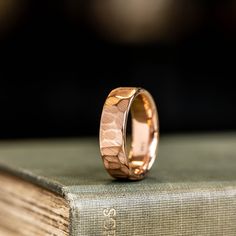 a close up of a ring on top of a book