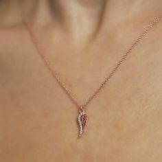 The symbolic Wing Charm Necklace is the ideal present for a loved one or for yourself. You will be charmed by this necklace and it will be a wonderful addition to your collection of designer accessories. Metal: 925 sterling silver Coating: 18k gold Pendant: 3.2 x 1.0 cm (1.25" x 0.4") Stones: cubic zirconia Chain style: cable link Chain length: 40 cm + 5 cm extender (16" + 2") Hypoallergenic: nickel-free materials used therefore suitable for those with metal allergies Rose Gold Adjustable Chain Necklace For Anniversary, Rose Gold Pendant Necklace As Gift For Her, Rose Gold Pendant Necklace Gift For Her, Rose Gold Necklace With Adjustable Chain For Her, Rose Gold Pendant Necklace For Her, Elegant Rose Gold Necklaces With Charms, Rose Gold Pendant Charm Necklaces With Adjustable Chain, Rose Gold Charm Necklace With Adjustable Pendant, Rose Gold Pendant Charm Necklace With Adjustable Chain