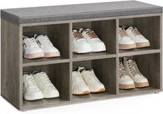 the shoe rack has six pairs of shoes in it