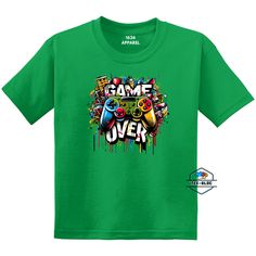 Boost your child's t-shirt game with our 'Game Over Gamer' T-Shirts. These cool tees are perfect for boys or girls who want to show off their individual style. Regular Youth Unisex Tee50% US Cotton / 50% PolyesterClassic Fit / Seamless BodyCrew Neck Themed Green T-shirt With Graphic Print, Green Themed T-shirt With Graphic Print, Green Themed T-shirt With Short Sleeve, Green Themed Short Sleeve T-shirt, Themed Green Short Sleeve T-shirt, Green Pre-shrunk Pop Culture T-shirt, Pre-shrunk Green Pop Culture T-shirt, Black Short Sleeve Gamer T-shirt, Cheap Gamer T-shirt With Crew Neck