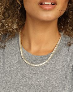 Our best selling Queen's Tennis Necklace had a baby! Easy and classy to put on and layer for a chic look. We are obsessed with how these give you regal elegance and make you feel like a Queen. DETAILS: Tennis Necklace Length: 18" 97 stones Box Push Clasp SKU: N6089 MATERIALS: 18k Gold Plated Over Brass Stone: 4x4mm Simulated Diamonds Dazzling Tennis Necklace For Everyday Luxury, Luxury White Clavicle Chain Necklace, Elegant White Gold Tennis Necklace, Elegant White Tennis Necklace With Clavicle Chain, White Gold Tennis Necklace With 17 Jewels, Elegant Cubic Zirconia Tennis Necklace, White Diamond Cut Chain Necklace For Formal Events, White Diamond Cut Chain Necklace For Formal Occasions, Luxury Tennis Necklace For Wedding