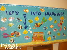 a bulletin board that says let's into learning with fish and marine life on it