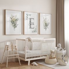 a baby's room with three framed pictures on the wall