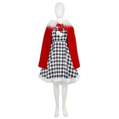 a white mannequin wearing a red coat and black and white checkered dress