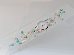 Description: Name: handmade turqouise beads bracelet watches Watch Case: IP plating              Size: 26mm            Mov't: Japanese  GL20 Band Width: 14mm Watch  Length: 17.5cm+3cm adjustable chain Band Material: copper wire + turquoise beads         Gurantee: 2 years gurantee for watch functional issues. Length and stone beads can be customized as you request.                          Package: Gift box as in the picture Shipping time: We make the item as soon as you order it, so it takes 3-5 Handmade Beaded Bracelet For Anniversary, Elegant Turquoise Beaded Bracelets As Gift, Elegant Handmade Turquoise Beaded Bracelets, Elegant Turquoise Jewelry With Bracelet Strap, Elegant Nickel Free Turquoise Beaded Bracelets, Elegant Nickel-free Turquoise Beaded Bracelets, Elegant Turquoise Beaded Bracelet, Beaded Watches, Turquoise Bead Bracelet