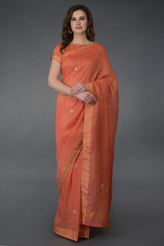 Coral hued saree with all over checkered texture and placement zardosi motifs. Comes with matching blouse.
Components: 2
Fabric: Kota linen, Cotton, Chanderi
Neckline: Bateau
Sleeve Length: Short
Color: Coral
Zardosi embroidery
Piping detail
Closure: Front hook buttons - Aza Fashions Coral Saree, Formal Saree, Indian Sari Dress, Coral Blouse, Simple Sarees, Embroidered Saree, Living Coral, Indian Bridal Wear, Linen Saree