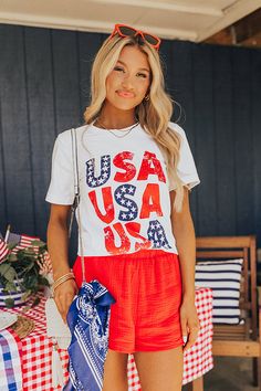 – Light up the skies this summer in our cute tee – Lightweight cotton material with red, white and blue USA graphic front – Round neckline – Short loose sleeves – Slouched silhouette that falls into a straight hemline Stars Graphic, Usa Pride, Loose Sleeves, Women Clothing Boutique, Red White And Blue, Hip Length, High Waisted Shorts, Online Womens Clothing, Boutique Clothing