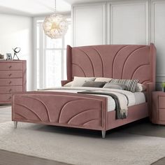 a bedroom with a pink bed and dressers