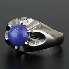 Vintage 14k White Gold Linde Lindy Blue Star Sapphire Cocktail Anniversary Ring This Ring Is Made Of 14 Karat White Gold & Displays A Large Blue Linde Sapphire. This Beautiful Stone Is Held By The White Gold Prongs That Form A Unique, Wave-Like Design Around The Stone. "14k" Is Stamped Onto The Ring's Band. This Ring Can Be Resized By Any Qualified Jeweler. Size: 8.25 Band Width: 3.9 Mm Metal: 14 Karat White Gold Weight: 6.72dwt // 10.45 Grams Gemstone: Linde Blue Star Sapphire 785299-1* E-343 Blue Star Sapphire Men Ring, Lindy Star Ring Sapphire, Star-shaped Sapphire Gemstone Rings, Blue Star Sapphire Ring, Blue Star Sapphire, Star Sapphire, Mens Accessories Jewelry, Blue Star, Blue Gold