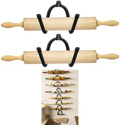 three wooden pegs are hanging on the wall and one is attached to a coat rack