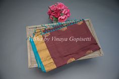 This Brown and Blue Kanchi Soft Silk Saree and Blouse is crafted from luxurious handloom silk for a traditional look and feel. Perfect for weddings and festivals, it's soft and comfortable to wear for all age groups. The beautiful combination of colors makes this saree a chic addition to any wardrobe. The accompanying saree blouse is tailored and embellished with handcrafted dori and tassels at the back. The attention to detail further enhances it and gives the blouse a great finish.