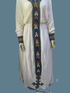 Fetel dress from axum Tigray Ethiopia. It's hand woven from an organic cotton and hand embroidered. The dress is very graceful and can be worn for a wedding, christening and holidays.  Please add your measurements when placing your order.  Since it's hand embroidered it takes about a month to make unless we have a ready-made one in your size delivery might take 4-6 weeks. Tigray Ethiopia, Ready Made, Dress Clothes For Women, Ethiopia, A Month, Christening, Hand Woven, Hand Embroidered, A Wedding